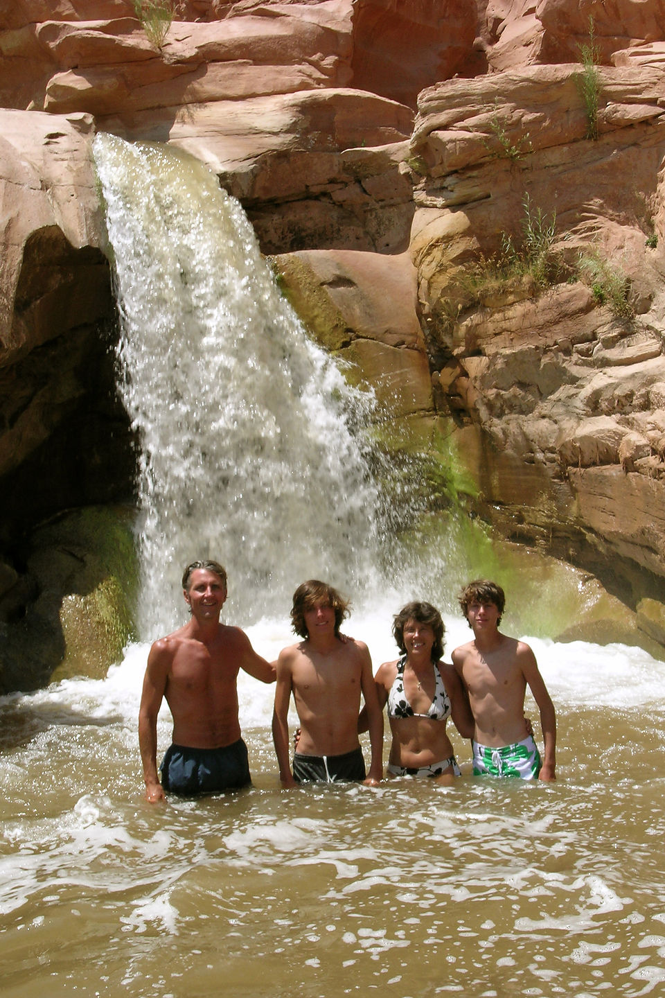 Family at base of Capitol Reef waterfall